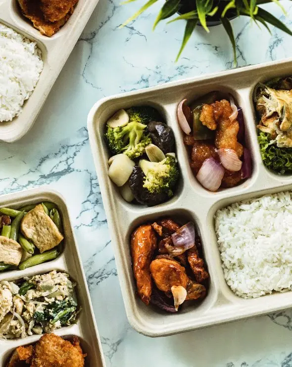 Bento box catering with rice, vegetables and chicken for office lunch in Singapore