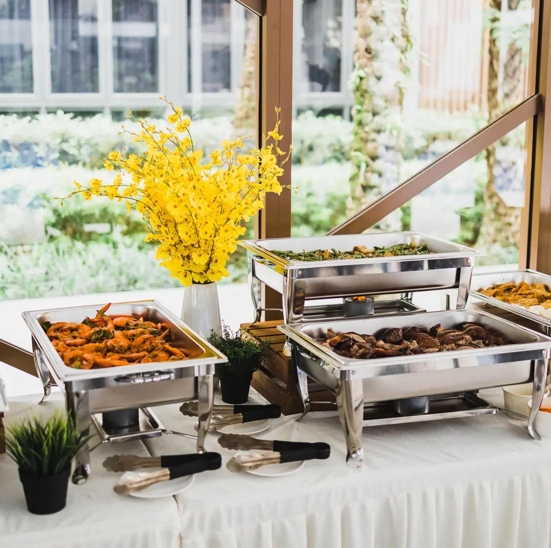 Buffet catering chafing dishes set up for an event in Singapore