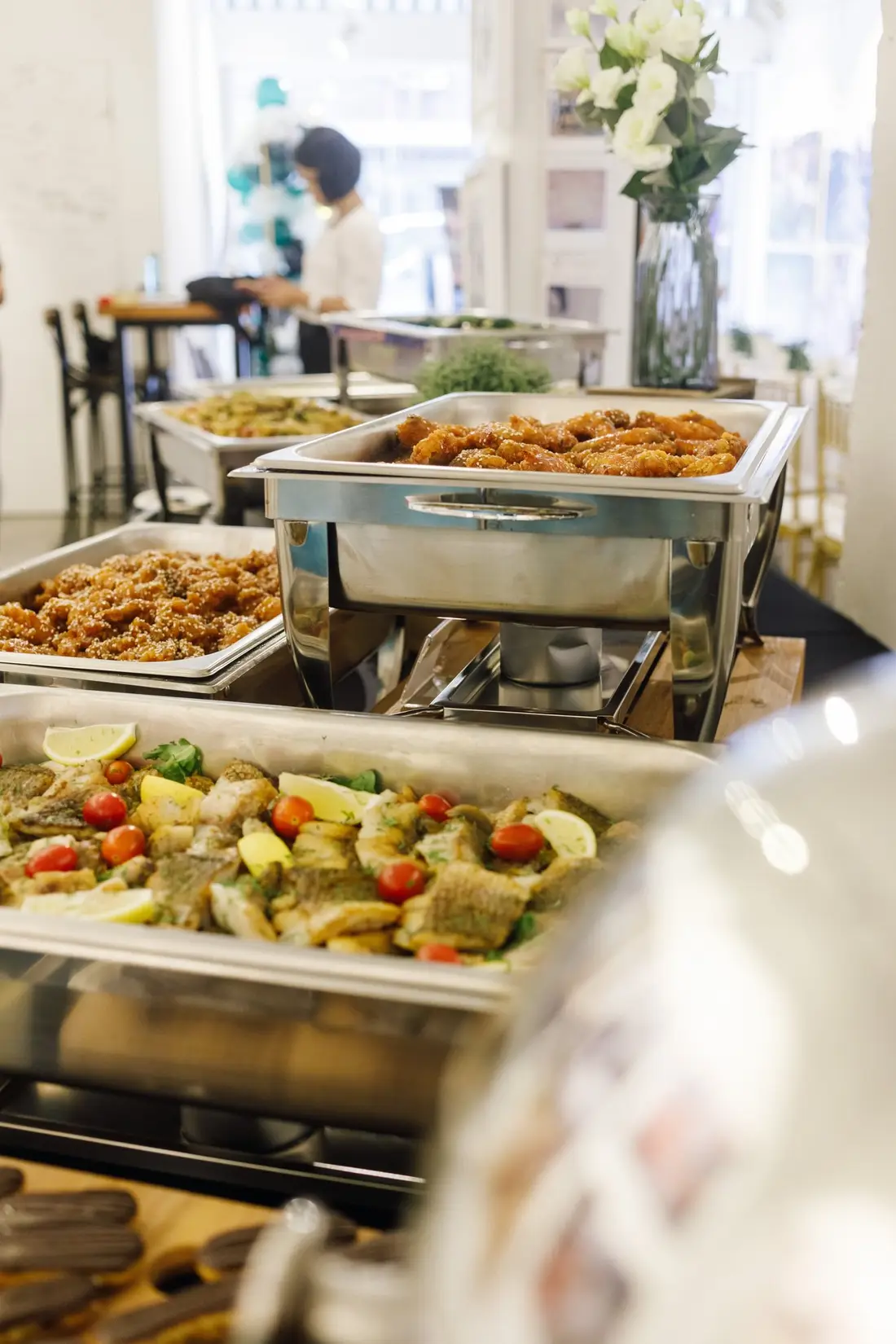 Christmas buffet catering setup with chafing dishes and a full buffet line in Singapore
