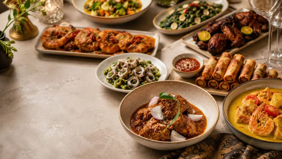 Spread of local dishes planned by Livingmenu for a catering order in Singapore